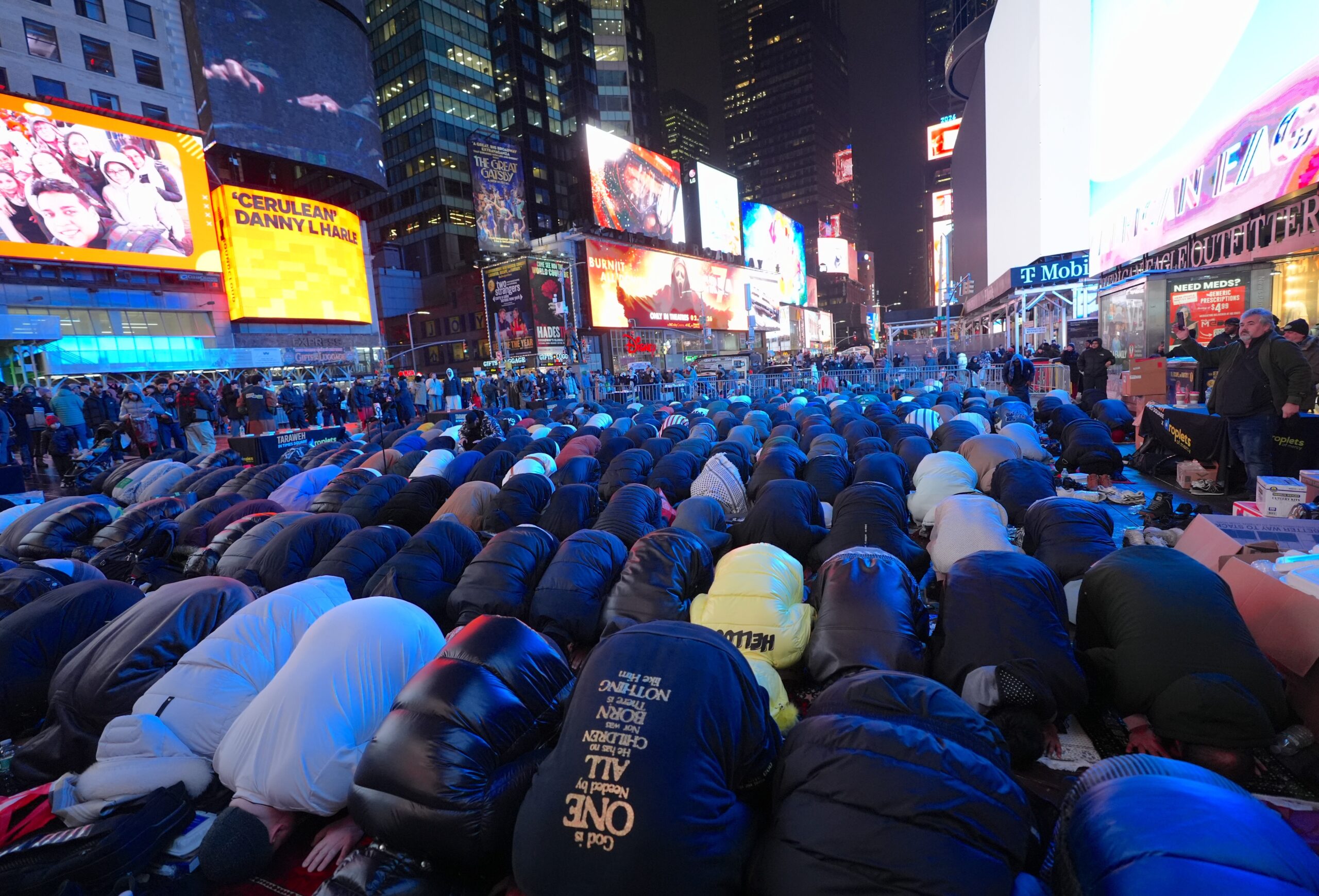 Muslims gather for iftar and Tarawih prayer in New York’s Times Square. | Image by Anadolu via Getty Images